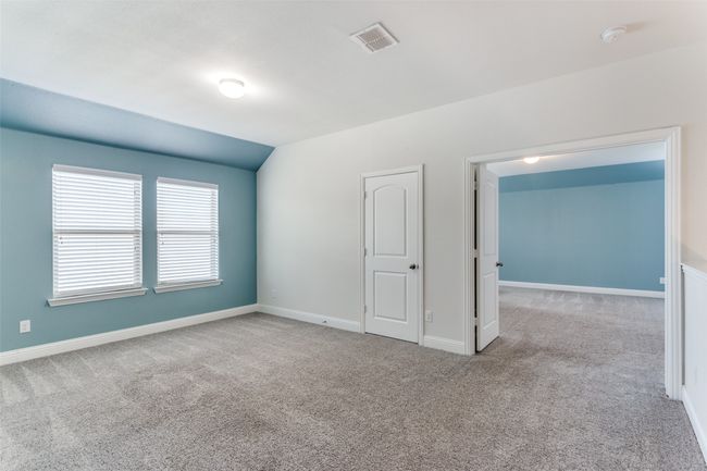 Carpeted spare room with vaulted ceiling | Image 19