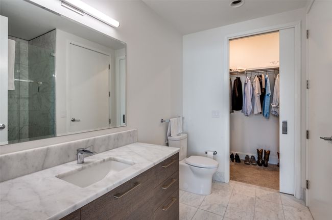 Full bath with vanity, a walk in closet, and a shower stall | Image 24