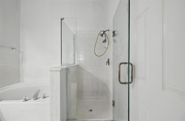 Full bath featuring a shower stall and a garden tub | Image 24
