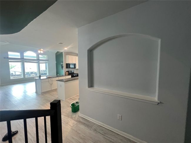 Corridor with light wood-style floors and baseboards | Image 20