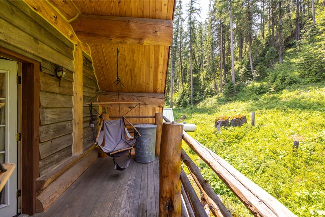 Wooden deck featuring a forest view | Image 108