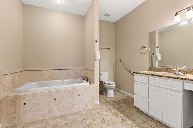 Primary Bathroom with dual vanities, garden tub and walk in shower | Image 28