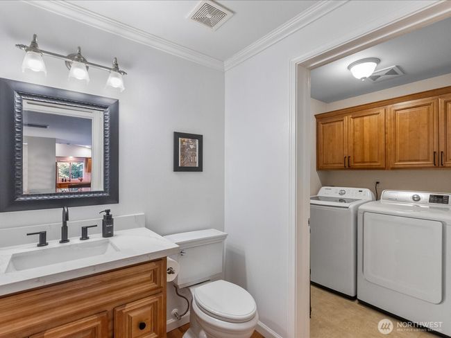 Half bath and laundry off family room | Image 17
