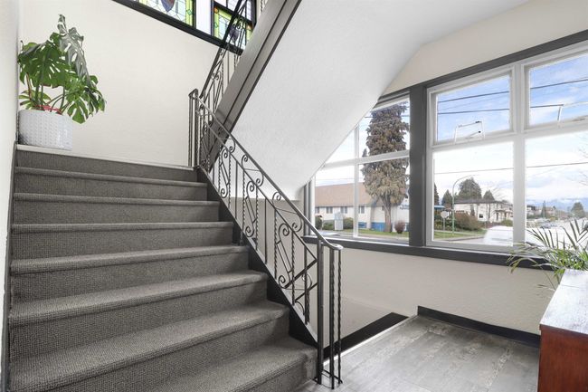 Stairway with baseboards and wood finished floors | Image 5