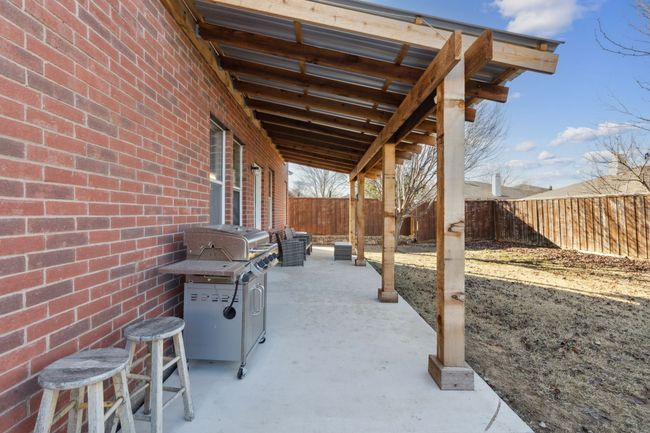 Covered patio perfect for grilling and relaxing | Image 26