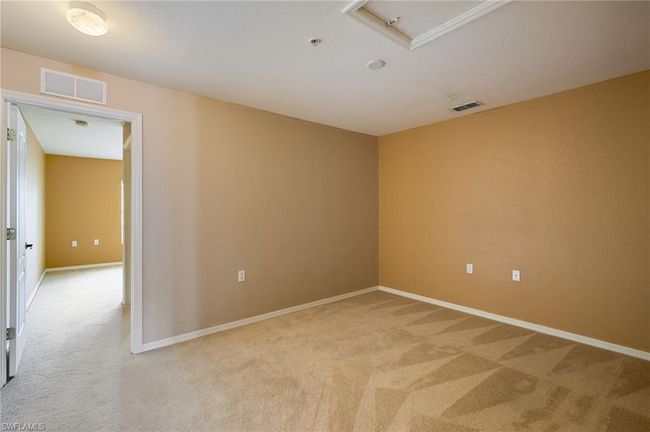 Spare room with light colored carpet and a pendent fire sprinkler | Image 9
