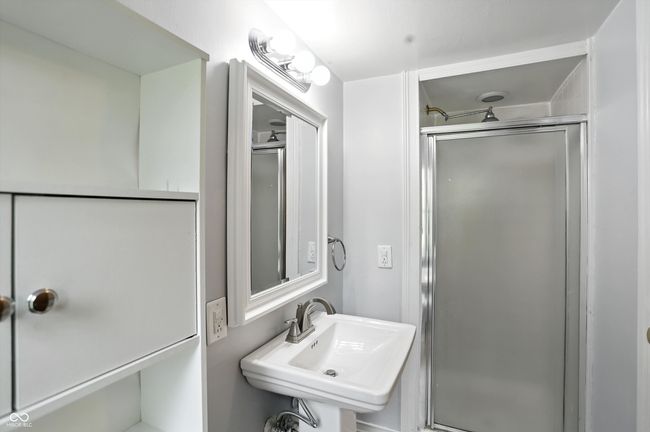 bathroom with a shower stall | Image 32