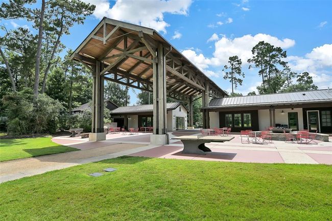 This resident hub offers a fire pit, a sprawling lawn, a state-of-the-art fitness center, a Woodland Playground, yard games and a Splash Pad | Image 34