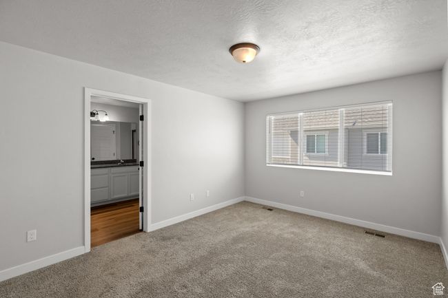 Spare room with carpet flooring and a textured ceiling | Image 20