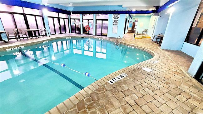 View of indoor community pool | Image 38