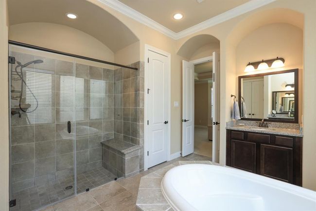 Very large shower area with sprayer and seat. Another bath closet. | Image 29