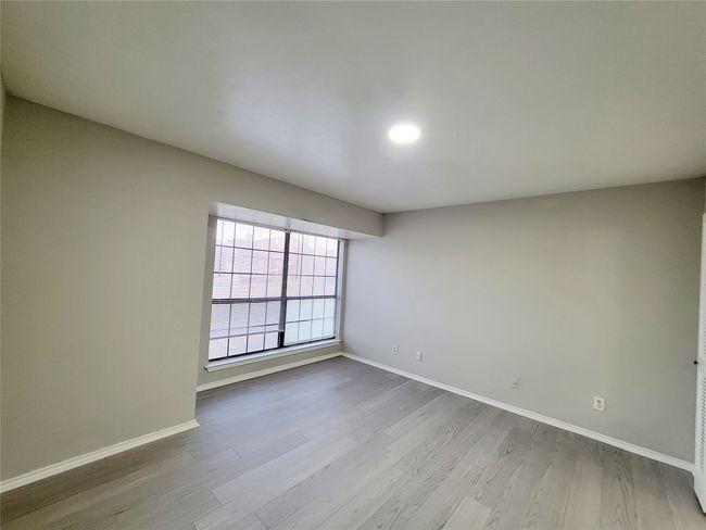 Unfurnished room with light wood-type flooring | Image 12