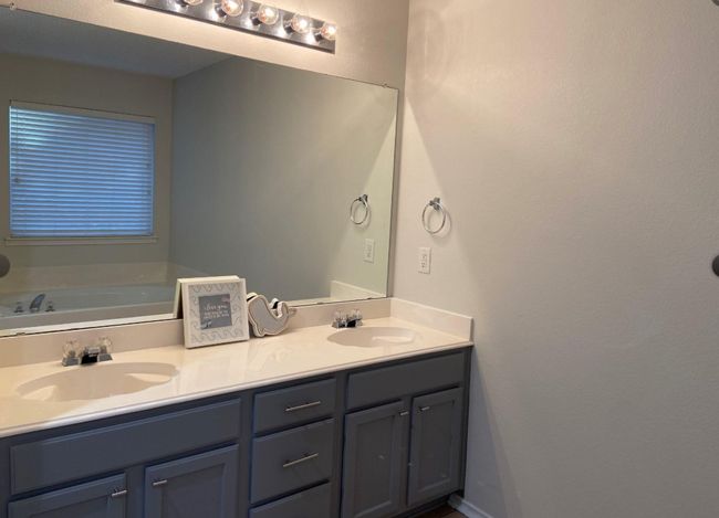Bathroom featuring double vanity and a garden tub | Image 18