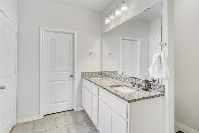 Bathroom with vanity and tile patterned flooring | Image 20
