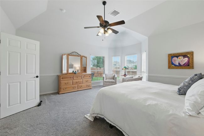 Bedroom with carpet floors, lofted ceiling, and a ceiling fan | Image 22