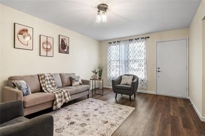 Living room with dark hardwood / wood-style flooring | Image 3