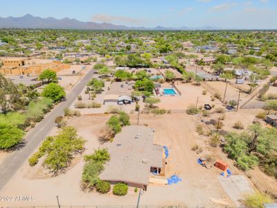 This home on a one-acre lot is on a street that is transforming with oversized Scottsdale luxury homes. The home in the upper left, framed, will be just shy of 10, 000 SF. | Image 1