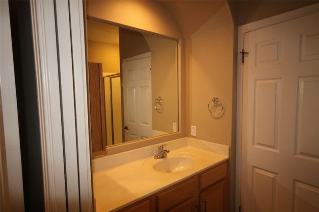Bathroom with vanity and an enclosed shower | Image 17