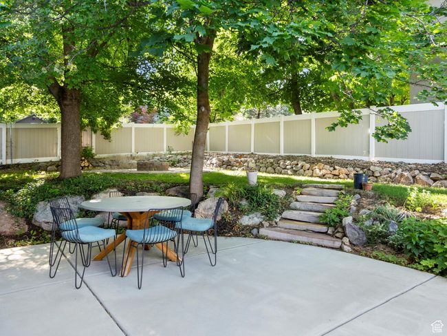 Fenced backyard with a patio and outdoor dining space | Image 40