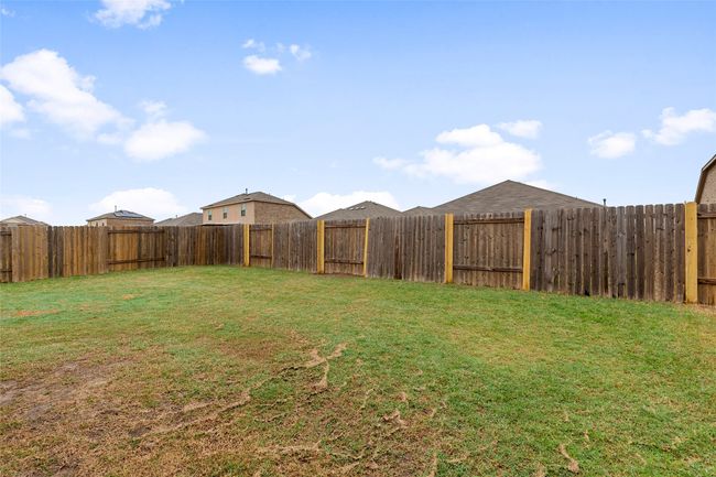 View of yard featuring a fenced backyard | Image 33