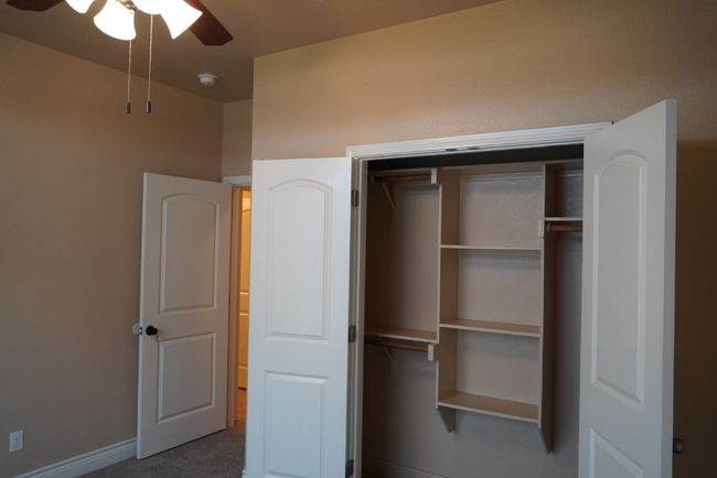 Unfurnished 3 bedroom featuring baseboards, a closet, carpet floors, and ceiling fan | Image 14