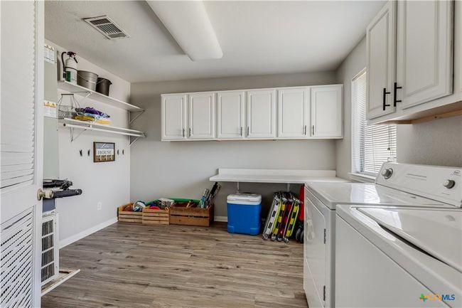Laundry room with tons of storage space | Image 30