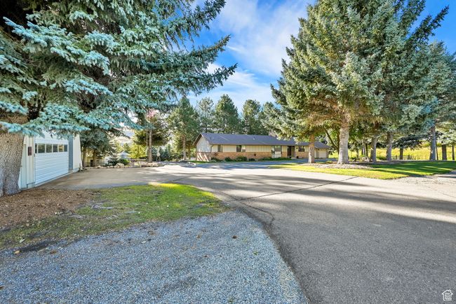 View of front facade with a front lawn | Image 5