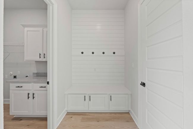 Mudroom and laundry room are conveniently adjacent as you enter from the garage. | Image 5