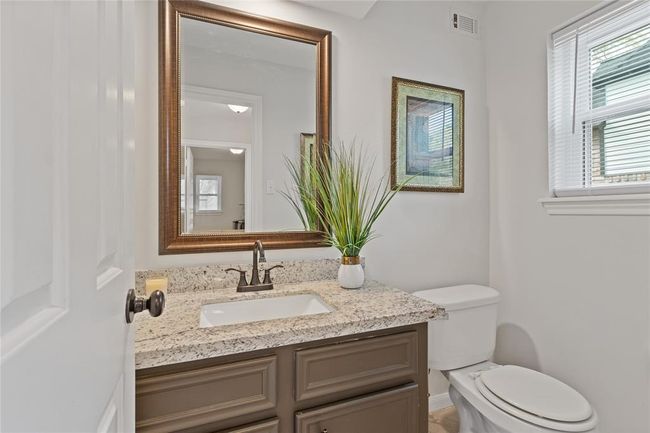 Half bath is across from utility room near back door. | Image 19