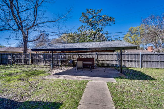 View of yard with a patio area and a fenced backyard | Image 19