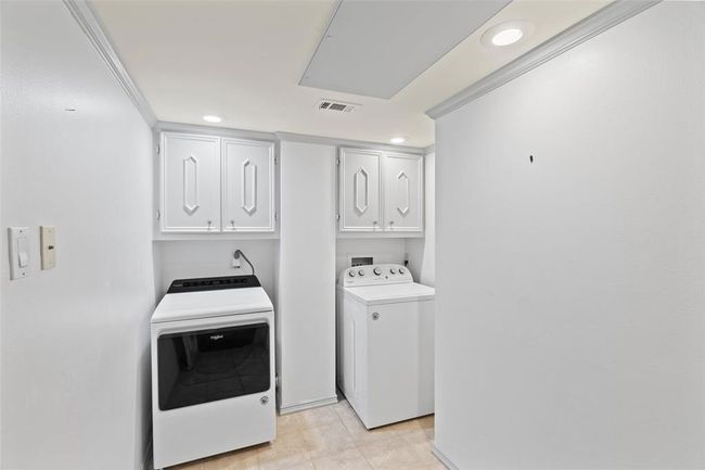 Utility room in unit with plenty of space for storage. | Image 25