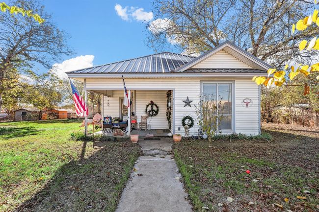 Bungalow with a porch and a front yard | Image 10