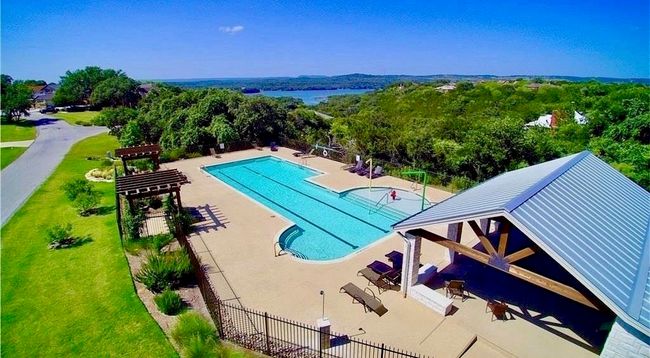 A Community Pool is within easy walking distance of 113 Courtside Way. Community amenities include this wonderful pool and gazebo area, tennis and pickle-ball courts, private boat launch, a waterfront park area with grills and benches, and a playground area for the children. | Image 27