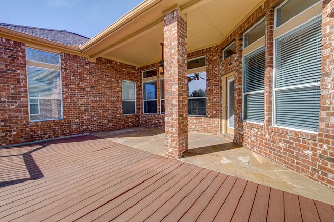 Wooden deck with a patio area | Image 34