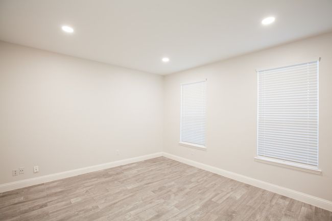 Spare room featuring light wood-style flooring and recessed lighting | Image 5