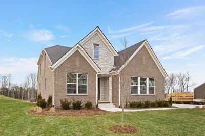 Welcome to the Damien C in Bear Creek Overlook. This is not the actual home but a likeness. Homes in Bear Creek will not include a side entry garage; front entry on most homesites. Photo is for informational purposes only. | Image 1