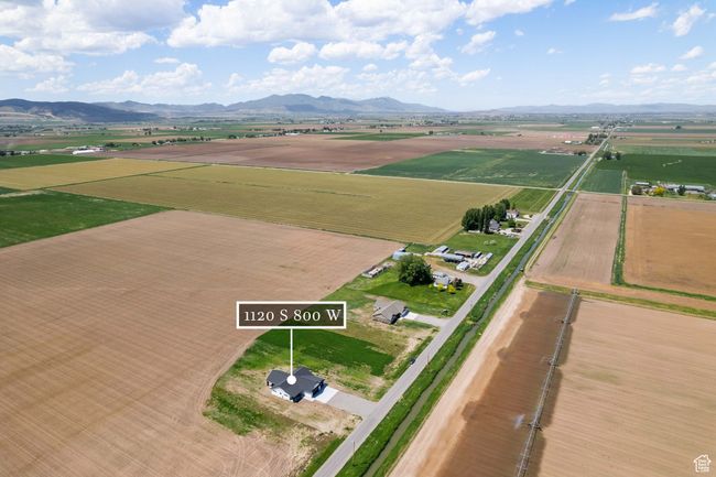 Aerial view of property and surrounding area featuring rural landscape, a mountainous background, and extensive farmland | Image 22
