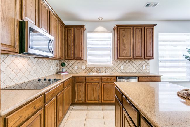 Lots of storage and natural light in this kitchen. | Image 4