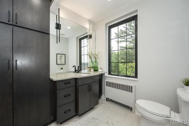 Primary bathroom with custom tile. | Image 14