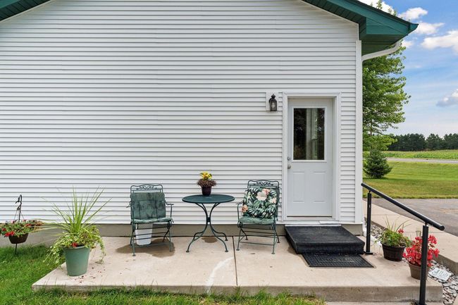 Unit entrance has a patio. | Image 14
