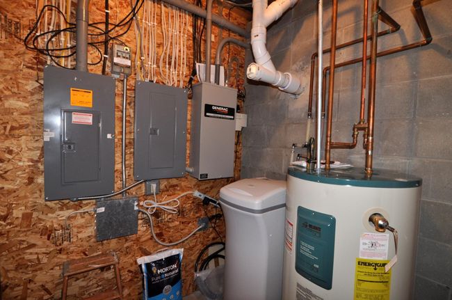 Utility room includes a generator panel, generator is included. | Image 48