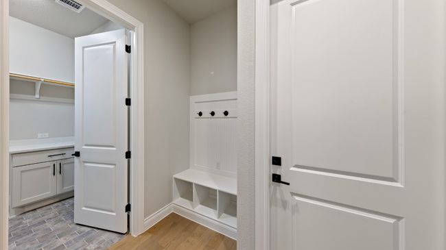 Mudroom featuring light wood-style flooring and baseboards | Image 37