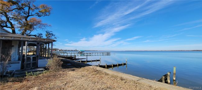 Dock area featuring a water view | Image 4