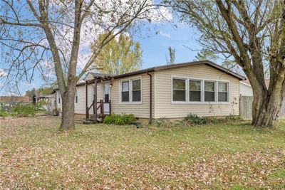 View of front facade with a front lawn | Image 3