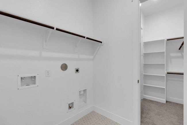This is utility room is adjacent to one of TWO primary closets and as you glide through the spacious layout, you'll appreciate the thoughtful design element. | Image 17