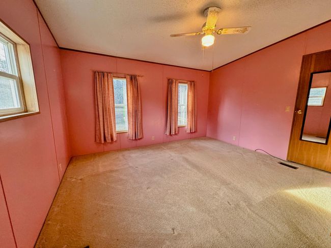 Bedroom #1 with 3 windows makes the room bright. | Image 14