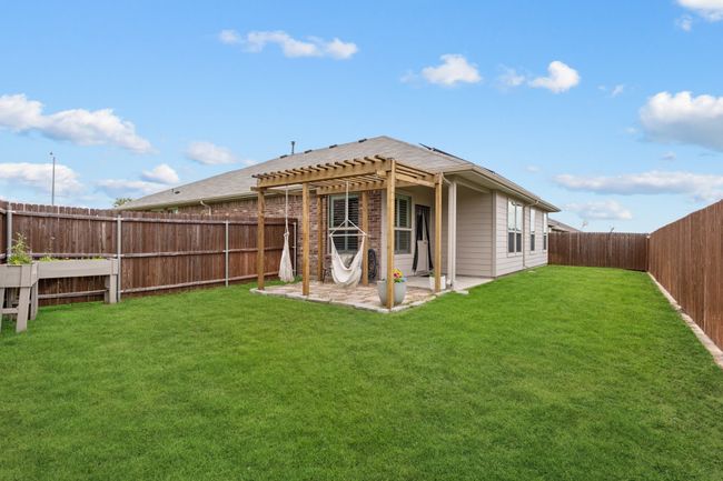 Back of house featuring a pergola, a fenced backyard, and a patio area | Image 23