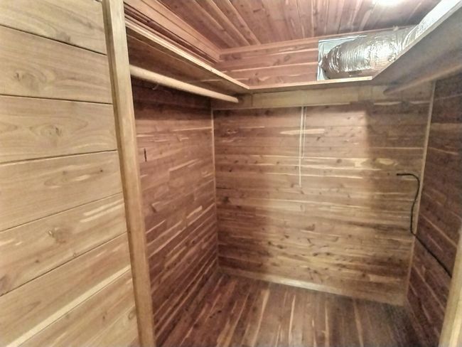Spacious closet featuring hardwood / wood-style floors | Image 36