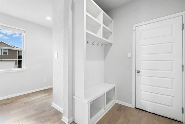 Mudroom with light wood-style flooring and baseboards | Image 20