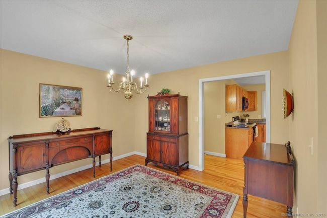 Large formal dining room with hardwood floors | Image 11